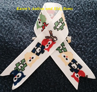 
              Ribbon Autism Awareness on pins
            